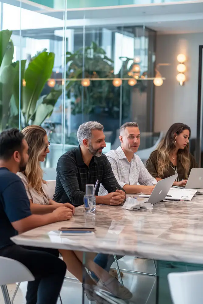 Nuerofy team meeting with resellers in a modern office